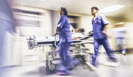 nurses running with stretcher